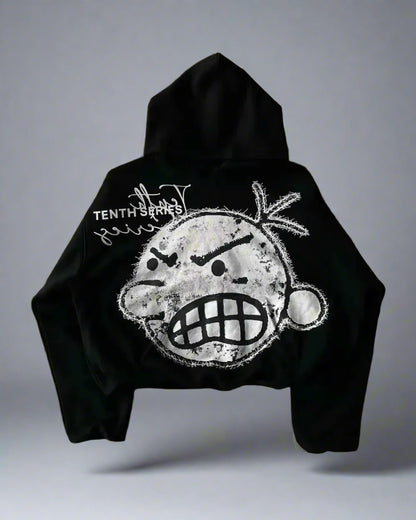 Black hoodie with a graphic design on the back against a gray background