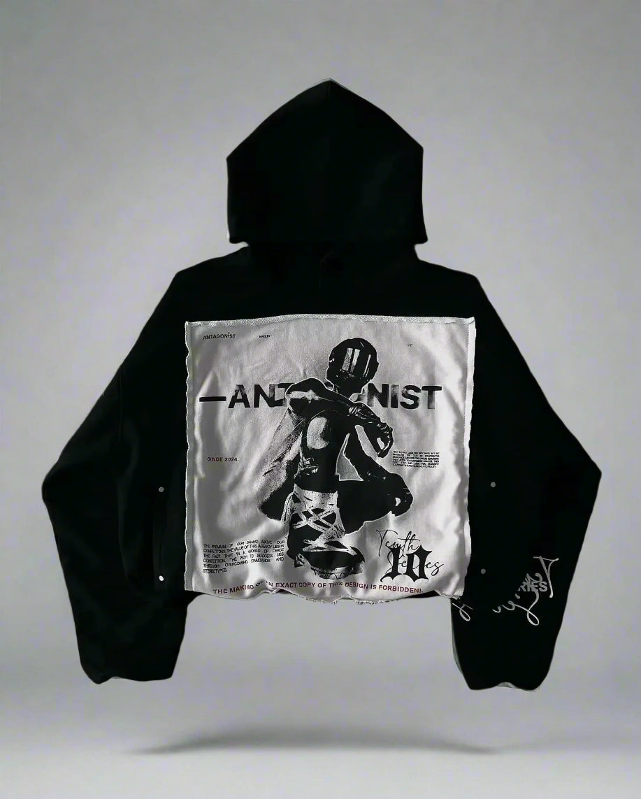 Black hoodie with a white graphic on a textured gray background