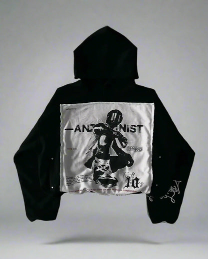 Black hoodie with a white graphic on a textured gray background