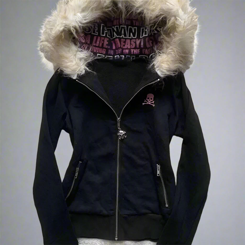 Black jacket with fur-lined hood on a textured white background