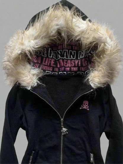 Black jacket with fur-lined hood on a textured surface